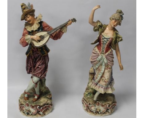 A PAIR OF CONTINENTAL FIGURES OF A MAN AND WOMEN IN 18th CENTURY STYLE DRESS WITH A MAN PLAYING A LUTE 