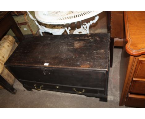 A SINGLE DRAWER EBONISED BLANKET BOX ON BRACKET SUPPORTS 