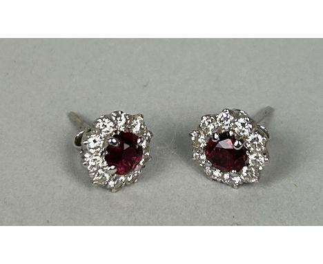 A PAIR OF WHITE GOLD CLUSTER EARRINGS EACH SET WITH A RUBY AND TEN DIAMONDSWeight: 2.6gms