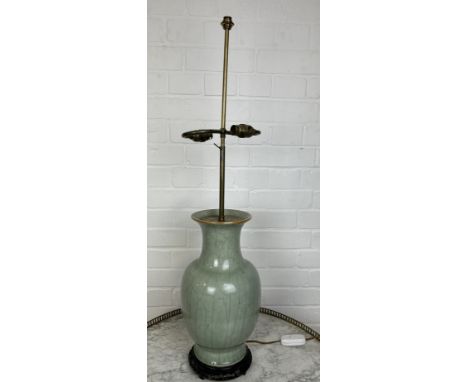 A CHINESE CELADON VASE ADAPTED FOR A TABLE LAMPWith wooden base, label for Harrods.Vase 38cm HWith lamp fitting for twin bulb