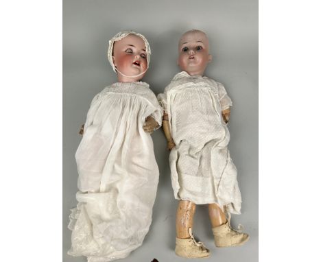 TWO BISQUE PORCELAIN DOLLS, ONE MARKED FOR ARMAND MARSEILLE, THE OTHER 'GERMANY'55cm L