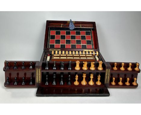 AN EARLY VICTORIAN MAHOGANY BOXED GAMES COMPENDIUM WITH STAUNTON CHESS PIECESWith chess (staunton pieces), draughts, cribbage