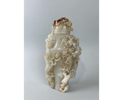 A CHINESE JADE VASE AND COVER DECORATED WITH BLOSSOM BRANCHES AND FLOWERS32cm H