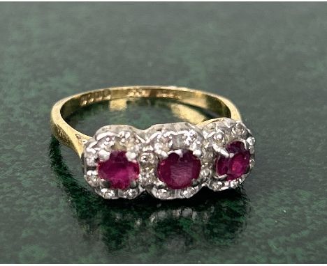 AN 18CT GOLD ENGAGEMENT RING SET WITH RUBIES AND DIAMONDSWeight: 3.5gms