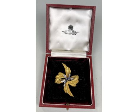 AN 18CT GOLD RIBBON BROOCH SET WITH SAPPHIRES AND DIAMONDS, WITH ASPREY AND CO BOXWeight: 16.8gms