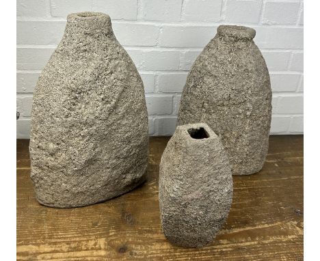 A SET OF THREE STONE FLASK VASESLargest H 37cm