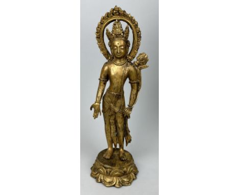 A GILT BRONZE BUDDHIST SCULPTURE DEPICTING AVALOKITESUARA33cm H