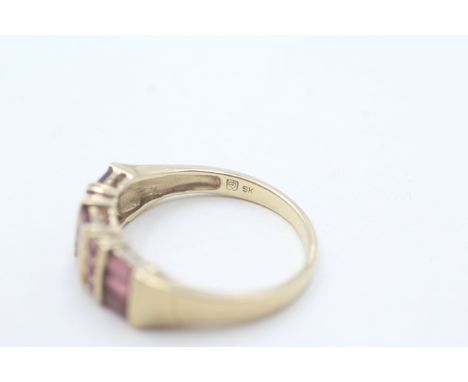A 9CT GOLD RUBY AND GARNET DRESS RINGWeight: 3.2gms