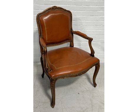 A FRENCH FAUTEUIL UPHOLSTERED IN TOOLED TAN BUTTON BACK LEATHER102cm x 68cm x 65cm