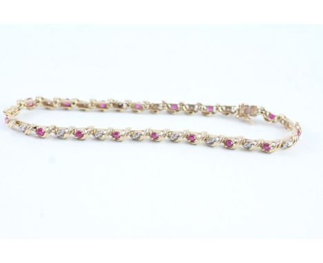  A 9CT GOLD RUBY AND DIAMOND BRACELETWeight: 5.7gms
