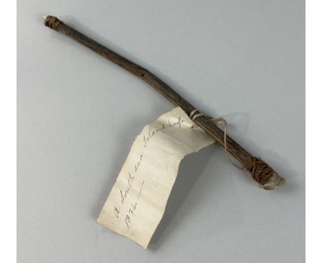 A 19TH CENTURY SOUTH SEA ISLAND KNIFE DATED 1834The knife crafted from a stick, with a sharp tooth possibly from a small shar