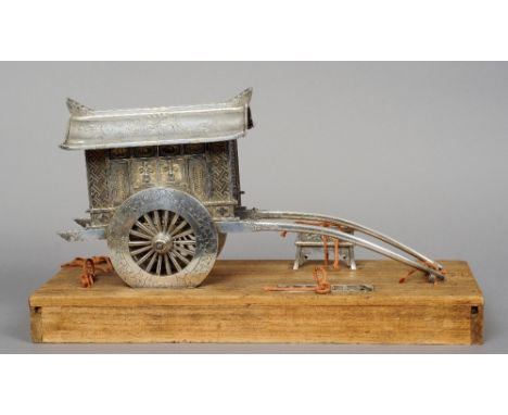 A fine quality Chinese unmarked silver model of a rickshaw 
With engraved and cast decoration, the rood engraved with two pho