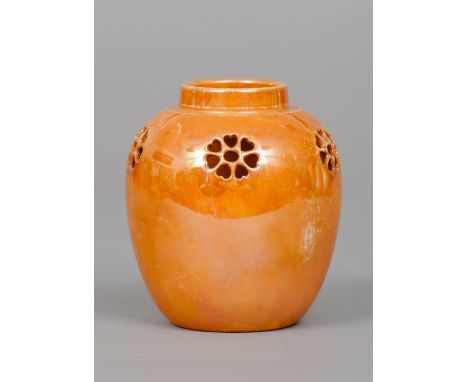 A Ruskin pottery reticulated ginger jar
With orange lustre glaze, impressed mark Ruskin, England and dated 1915.  11 cm high.