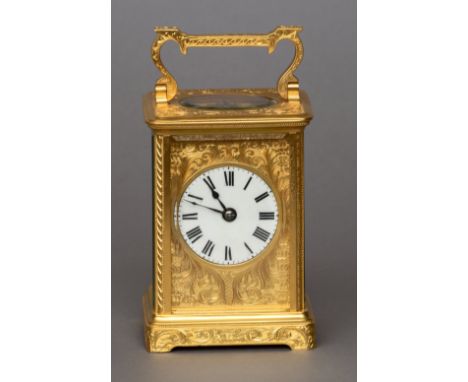 A 19th century French gilt brass striking carriage clock
The white enamel dial with Roman numerals set in engraved gilt brass
