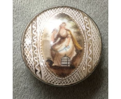 A George III white metal pill box
The enamelled bowed glass cover enclosing a portrait miniature of a young lady with songbir