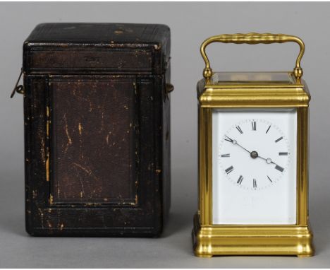 A 19th century French gilt brass cased striking carriage clock
The white enamel dial with Roman numerals, housed original lea