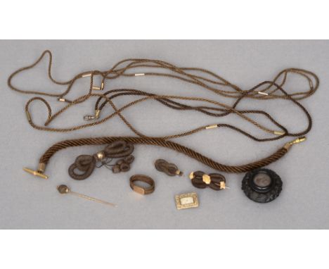 A collection of various unmarked yellow metal mounted Victorian braided hair jewellery
Including brooches, necklaces, a watch