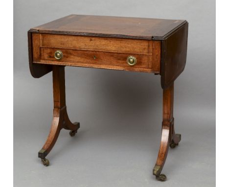 A 19th century inlaid mahogany sofa games table
The hinged twin flap top centred with a removable section, the underside inla