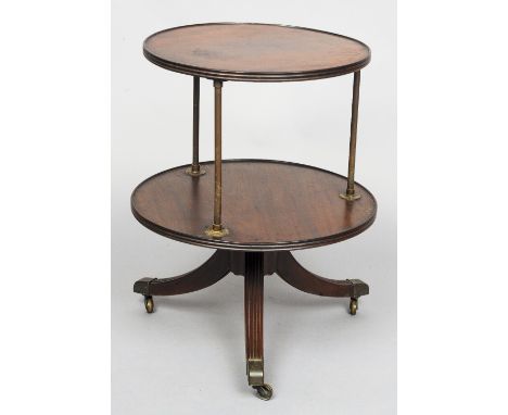 A 19th century mahogany two tier dumb waiter
Each tier of reed circular form separated by tubular brass uprights, standing on