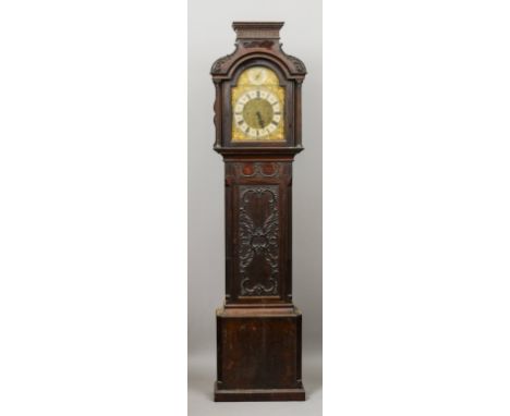 An Edwardian mahogany longcase clock
The case in the Chippendale style, the engraved brass dial with Roman and Arabic numeral