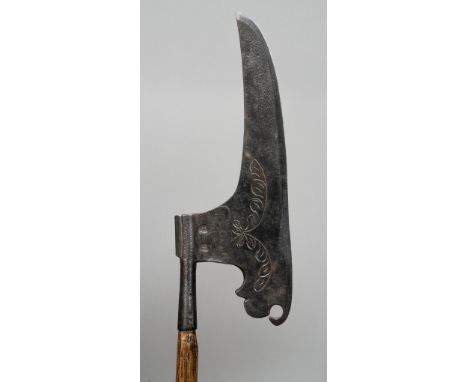 A 16th/17th century side axe
Of typical form with an engraved and stamped blade.  132 cm long. CONDITION REPORTS: Some pittin