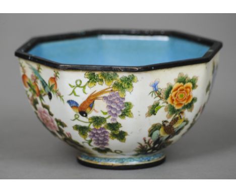 A Canton enamel octagonal bowl
The exterior decorated with birds amongst foliage, the underside with blue painted seal mark. 