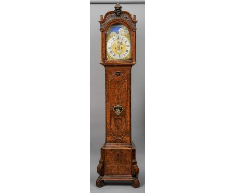 An 18th century Dutch burr walnut cased longcase clock, Jan Henkels, Amsterdam
The figurally mounted turned top above the sil