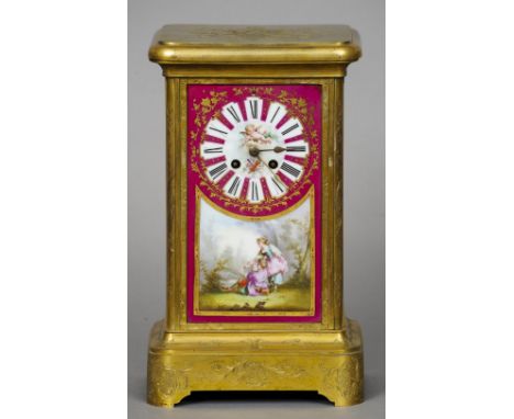 A 19th century Continental Sevres style painted porcelain panel mounted mantel clock
The dial with Roman numerals, painted wi
