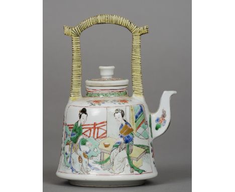 A Chinese Kangxi porcelain famille verte teapot The angular loop handle above the removable lid, the main squat bulbous body 