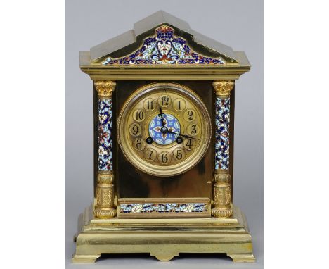 A 19th century French champleve enamel mounted brass mantel clock
Of architectural form.  30.5 cm high. CONDITION REPORTS: So