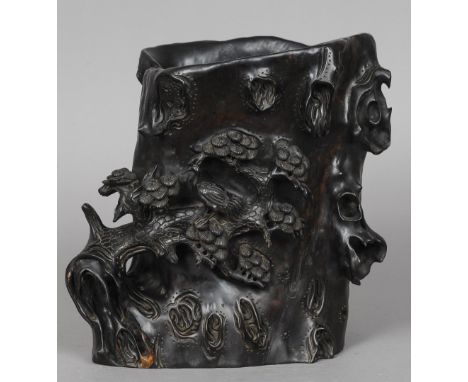 A Chinese carved zitan wood brush pot
Naturalistically carved as a tree trunk, one leafing branch with perched exotic bird.  