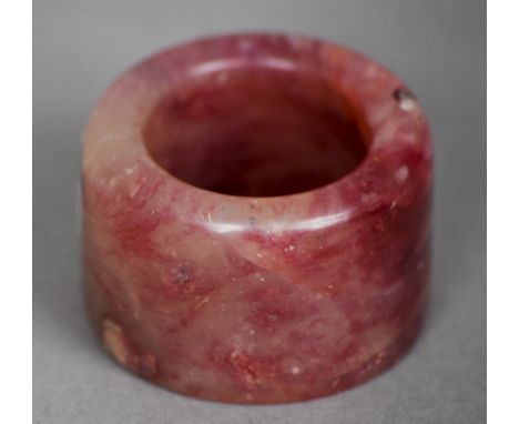 A Chinese russet jade archers ring
Of typical form. 3.25 cm diameter. CONDITION REPORTS: Overall good, some general wear.