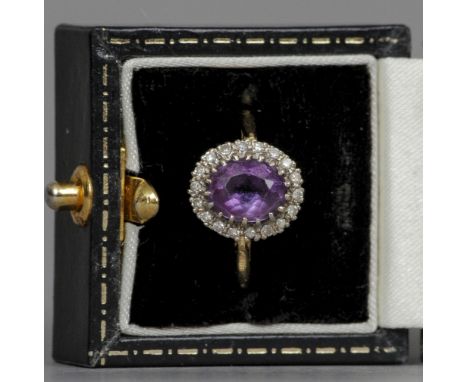 An 18 ct gold, diamond, amethyst cluster ring
 CONDITION REPORTS: Overall good, some inclusions, general wear.