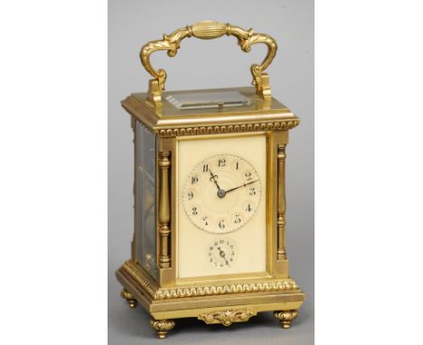 A 19th century gilt brass cased grand sonnerie carriage clock
The ivory dial with Arabic numerals and subsidiary alarm dial. 