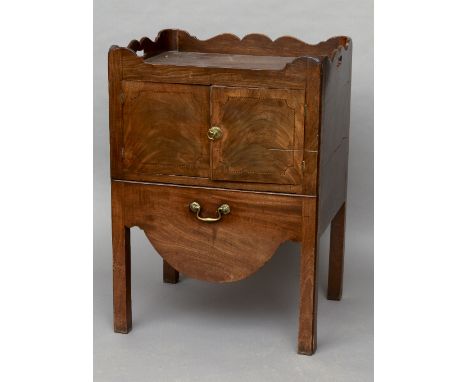 A George III mahogany tray top bedside commode
Of typical form, with twin cupboard doors above the drawer.  58.5 cm wide. CON