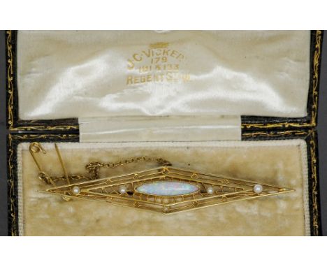 An opal and pearl set openwork gold brooch, tests as 18 ct
In fitted case for J.C. Vicker, Regent Street.  7 cm wide. CONDITI