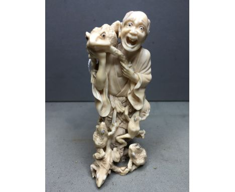 A 19th century Japanese carved ivory okimono
Of the Toad Immortal Gama Sennin, typically worked with toads.  12.5 cm high. CO