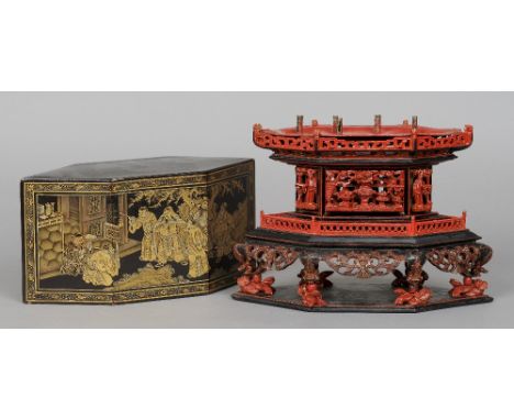 A 19th century Chinese joss-stick stand Of hexagonal section, the metal lift out tray above pierced and carved figural panels