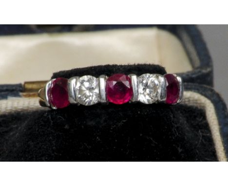 An 18 ct gold, diamond and ruby five-stone ring
Set with two diamonds and three rubies.  CONDITION REPORTS: Some small inclus