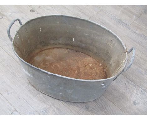 A 1950 dated galvanised wash tub with broad arrow mark 