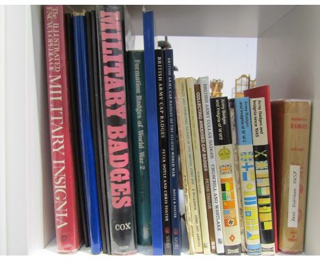 A collection of reference books on military badges including "British Army Cap Badges of The First World War" and "Military I