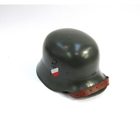 A German 1916 pattern helmet later refinished with army decals. Buyer to determine age