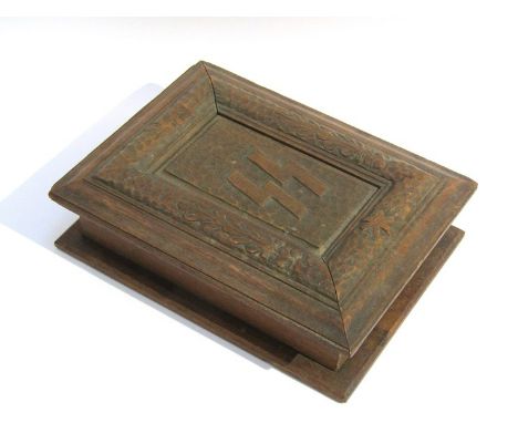 A mid 20th Century carved hardwood trinket box with SS and Swastika emblems 