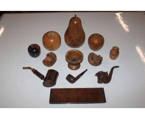A box of carved wooden fruit, a Major silver collared pipe, a carved wooden bulls head pipe with glass eyes, a cribbage board