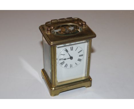 A brass cased carriage clock with key