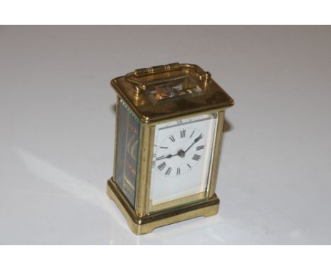 A brass cased carriage clock with key 