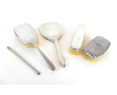 A silver engine turned five piece dressing table set, Deakin & Francis, Birmingham 1963 CONDITION REPORT: Comb incomplete. De