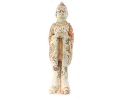 A Tang Dynasty painted pottery figure modelled as a guard wearing a long garment, h. 54.5 cm*see Lot 192 Sotheby's Chinese, J