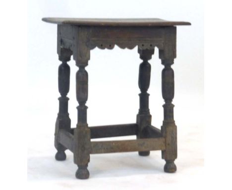 An 17th century and later oak joint stool, h. 55 cm CONDITION REPORT: Heavy wear, later aspects throughout, structurally soun