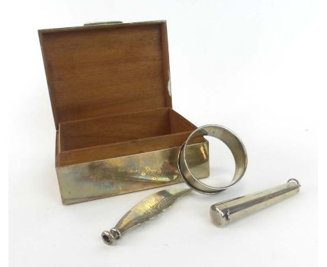 A silver engine turned cigarette box, London 1959, w. 11 cm, together with a silver napkin ring, cheroot holder and knife bla